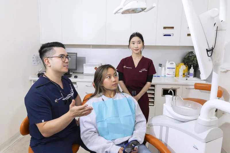 The Implant Standard clinical team talking a patient through her treatment plan