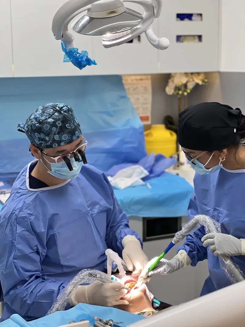 Implant surgery under theatre lighting at The Implant Standard
